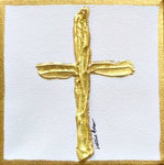 Gold cross on white