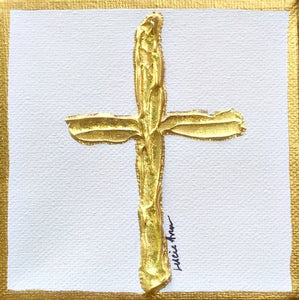 Gold cross on white